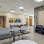 lobby, chairs, bench, room, table, pictures, walls, entry, ceiling lights, sitting area